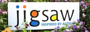 Jigsaw Trust logo-in-flowers-